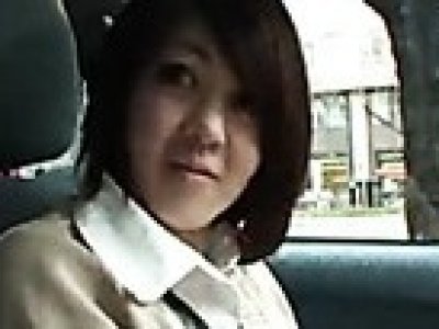 Japanese woman playing naughty in the car