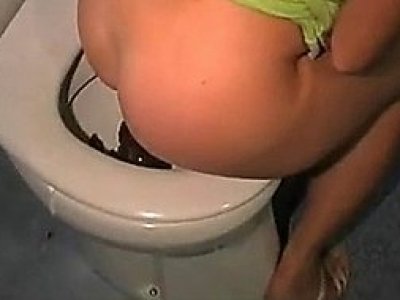 Woman pooping on the toilet