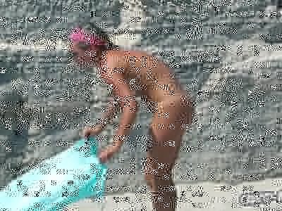Hot tattoed blonde nudist babe spied by voyeur at the beach