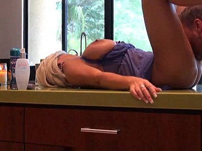 Housewife in a hot dress boned in her house