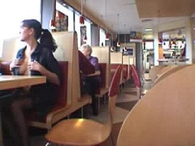 Curvy beauty flashing in a restaurant