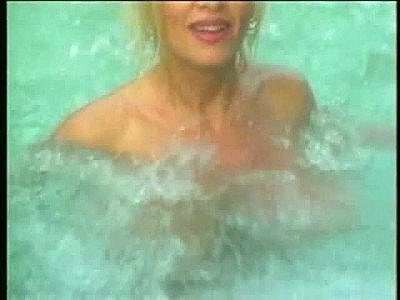Big tits girl splashing in the hot tub slow motion